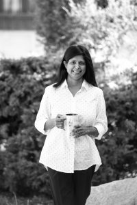 Black and white portrait of Geetha Moorthy.