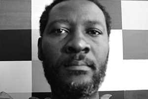 Black and white portrait of Peter Owusu-Ansah.