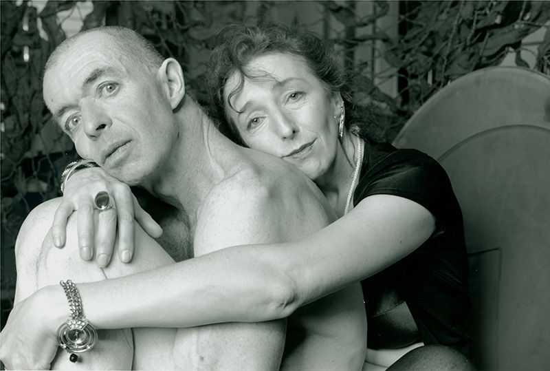 A nude man and a woman posing for a portrait.
