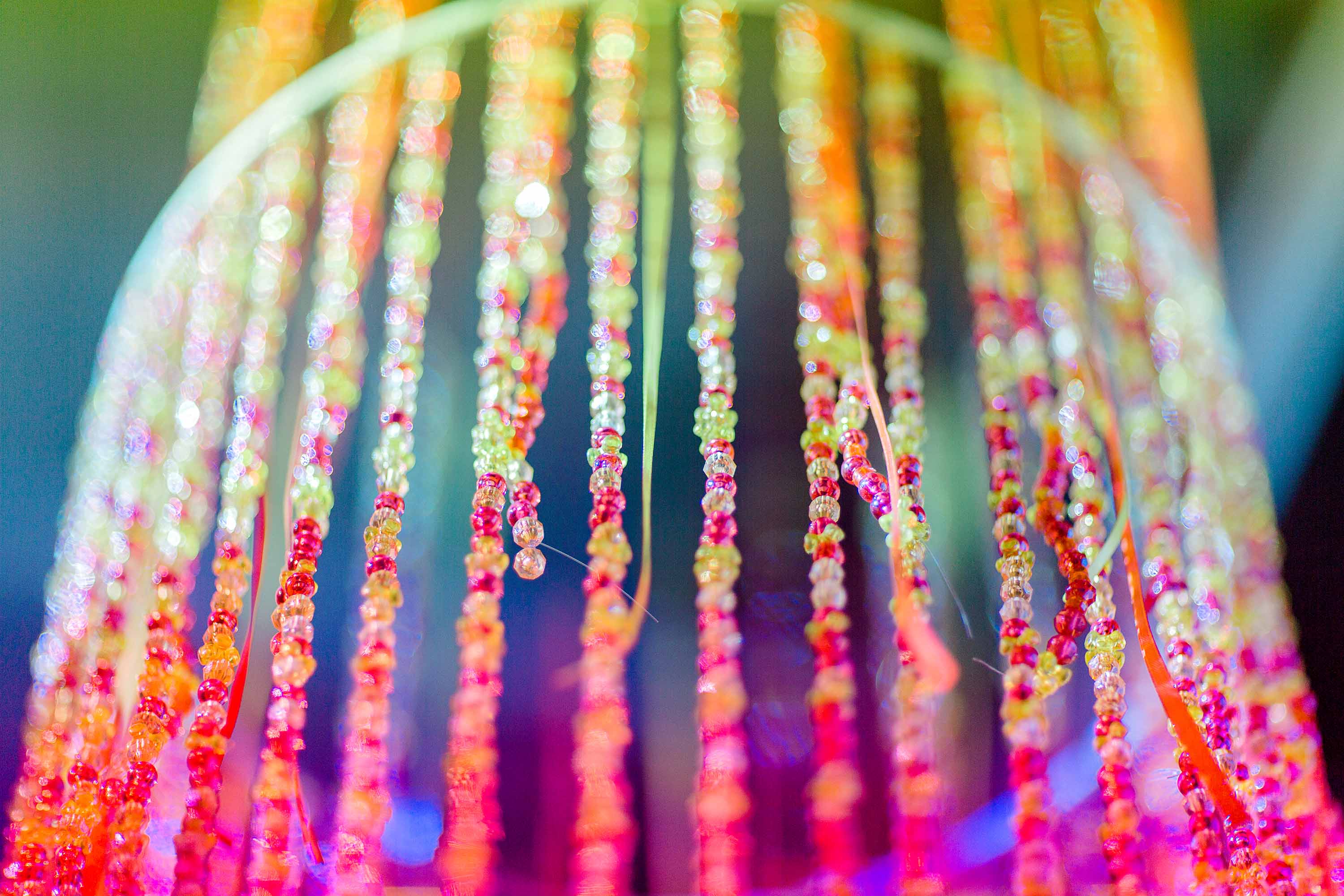 A close-up of a beaded curtain.